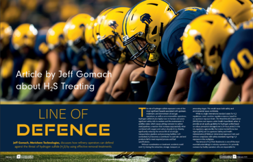 Football players in a row at the line of scrimmage ready to defend