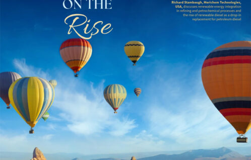 Brightly colored hot air balloons over mountains and rock formations set against a blue sky with headline about Renewable diesel