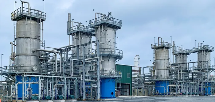 multiple LO-CAT units in midstream plant for H2S removal from gas streams; tall metal vessels with platforms and piping